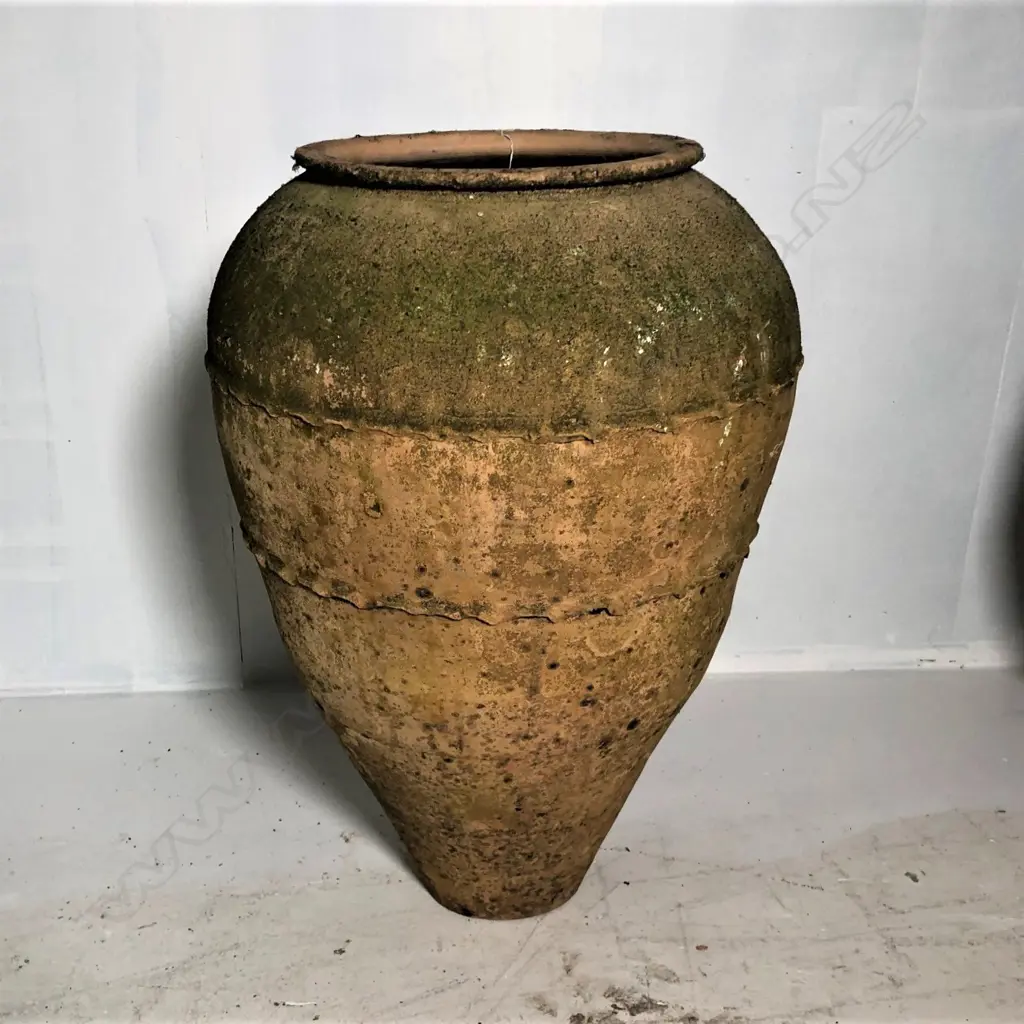 An old European terracotta tall olive oil storage jar Image 1++