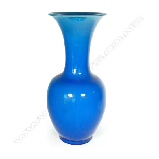 A large Chinese porcelain blue monochrome glazed fengweizun vase