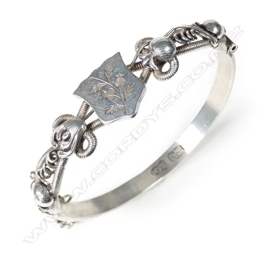 An early 20thC Chinese silver hinged bangle