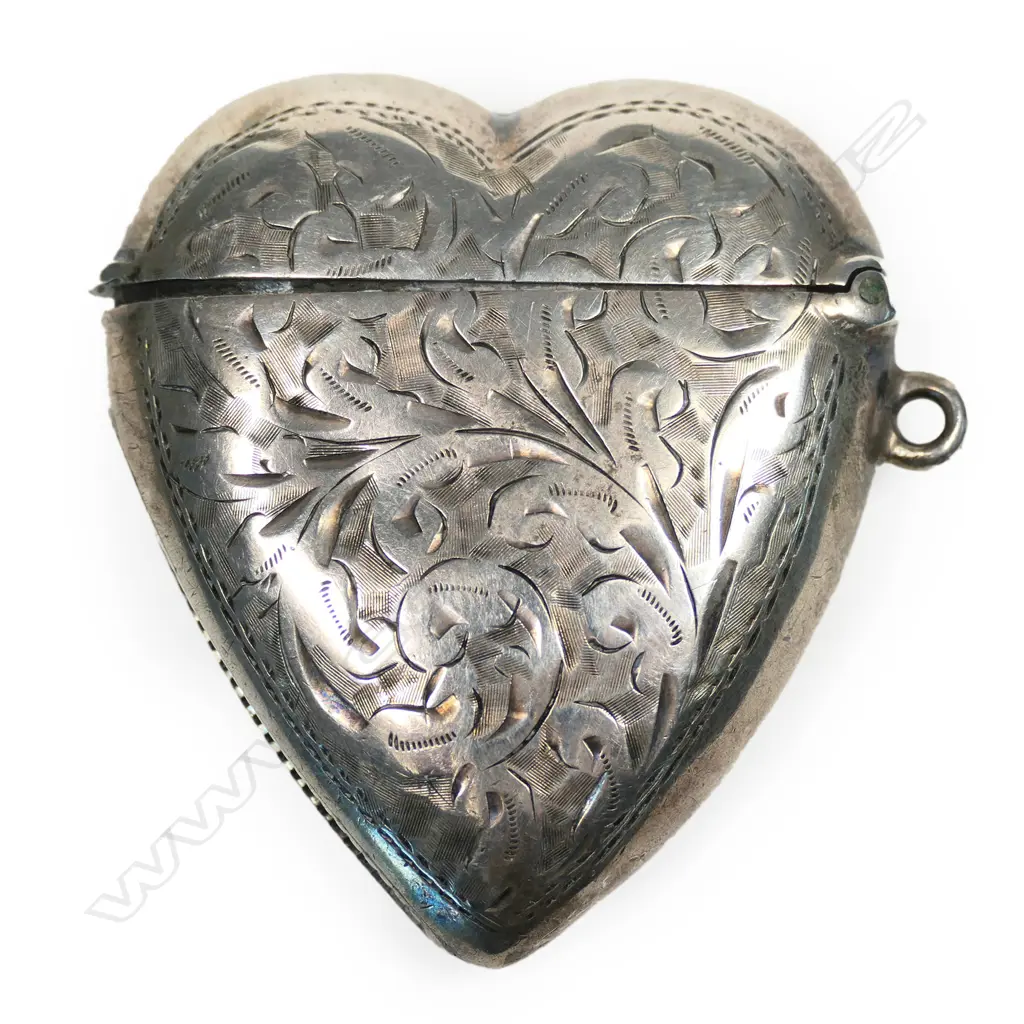 A late Victorian silver heart form engraved vesta Image 1++