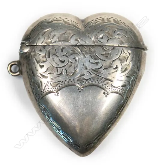 A late Victorian silver heart form engraved vesta