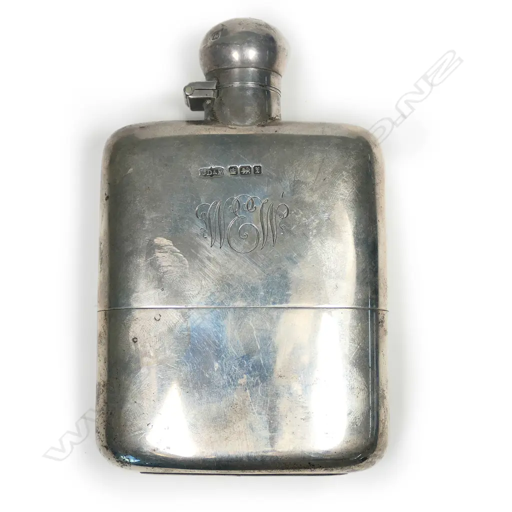 A silver hip flask Image 1++