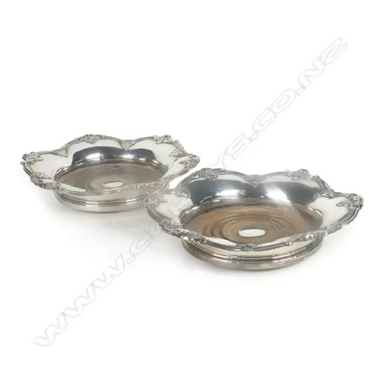 A pair of Victorian silver on copper bottle coasters