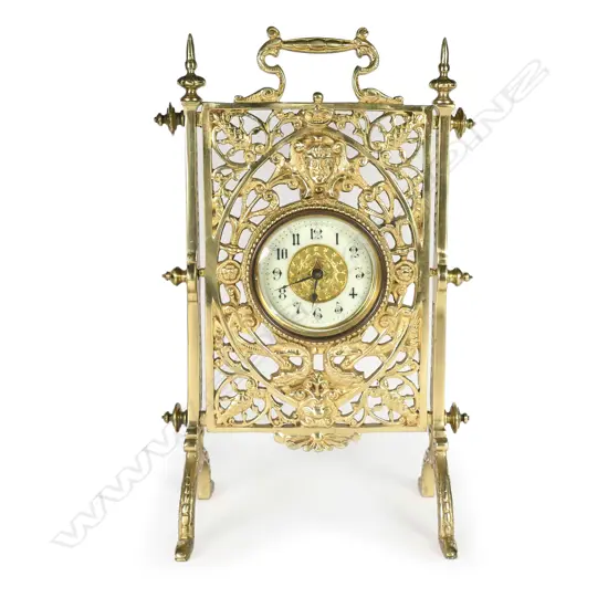 A 19thC French decorative brass table/desk clock