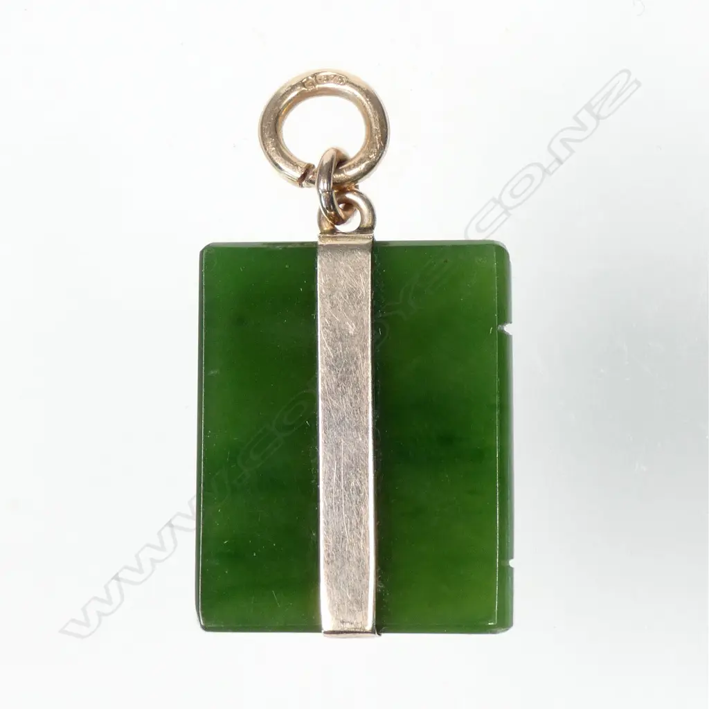 An early 20thC greenstone and 9ct. gold mounted book form pendant Image 1++