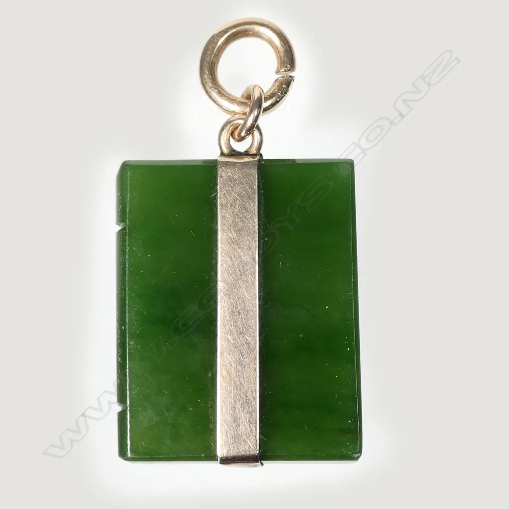 An early 20thC greenstone and 9ct. gold mounted book form pendant Image 1++