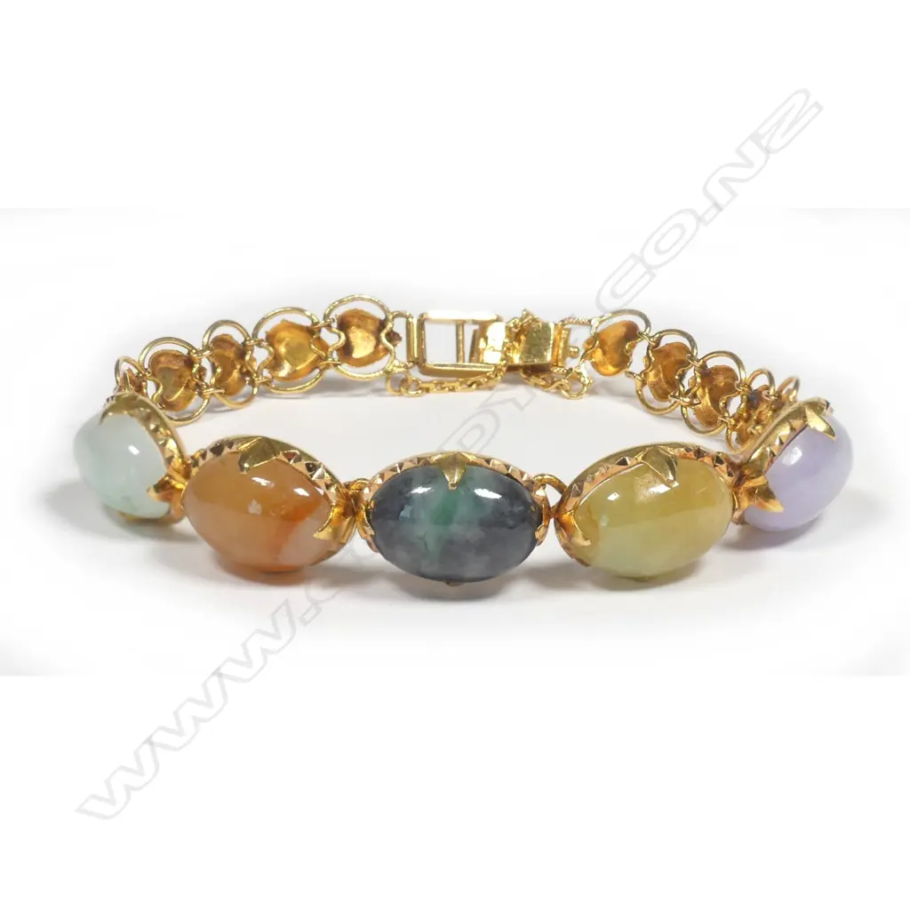 A 22ct. yellow gold and variously coloured jadeite cabochon bracelet Image 1++