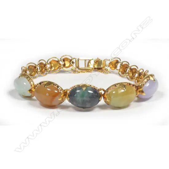 A 22ct. yellow gold and variously coloured jadeite cabochon bracelet