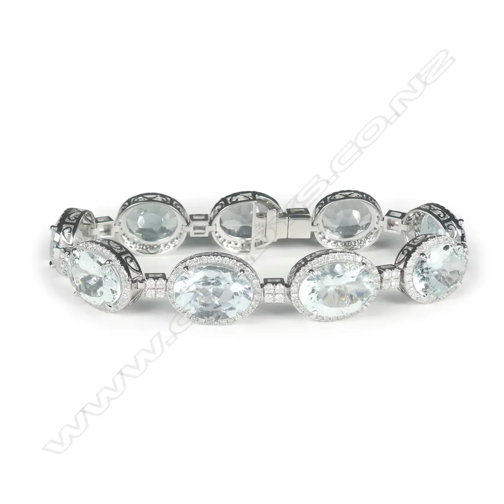 A 14ct white gold aquamarine and diamond halo bracelet Image 1++