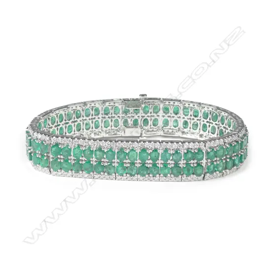A 14ct white gold emerald and diamond bracelet