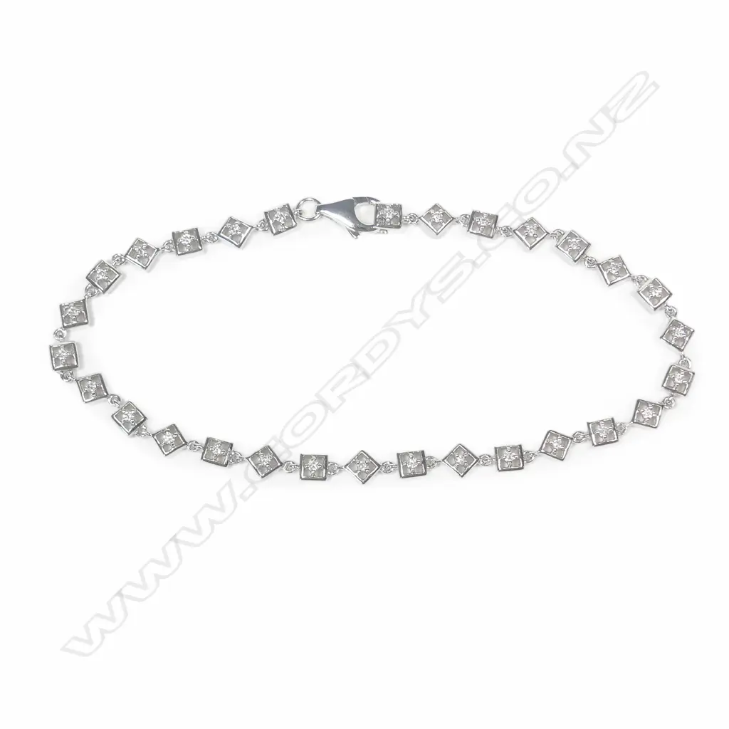 An 18ct white gold and diamond bracelet Image 1++