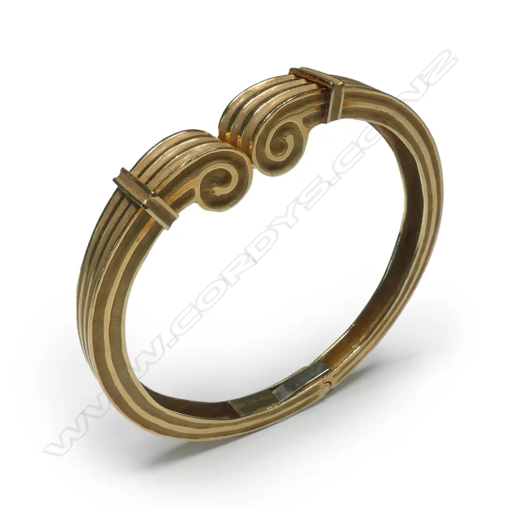 An 18ct gold Greek style hinged bangle Image 1++