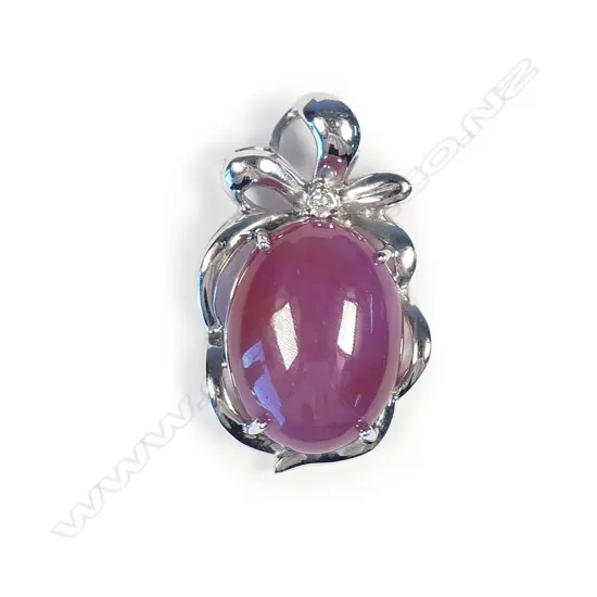 An 18ct white gold ruby and diamond pendant