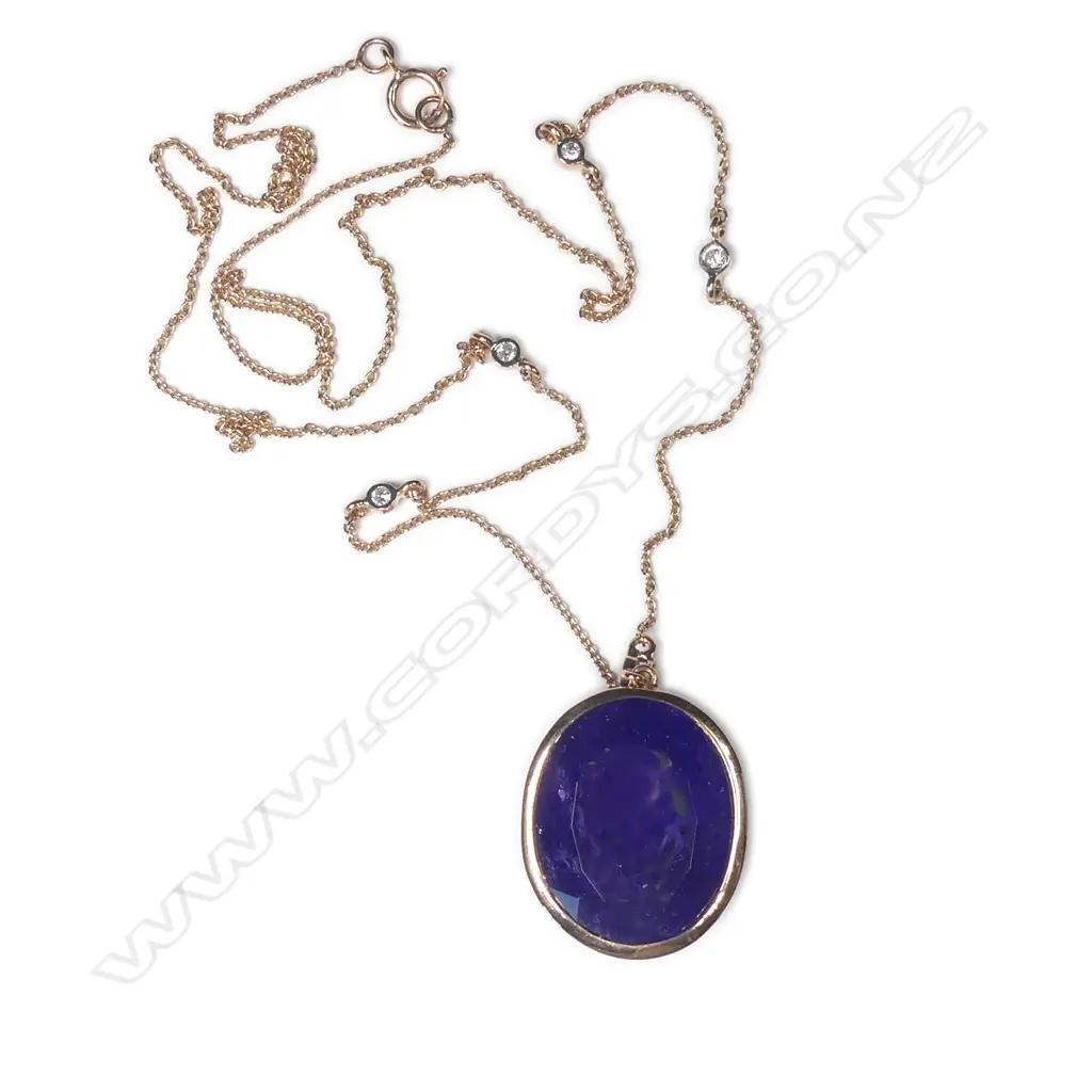 A 14ct rose gold tanzanite and diamond pendant Image 1++