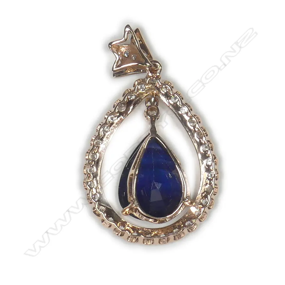 A 14ct rose gold sapphire and diamond drop style halo pendant Image 1++