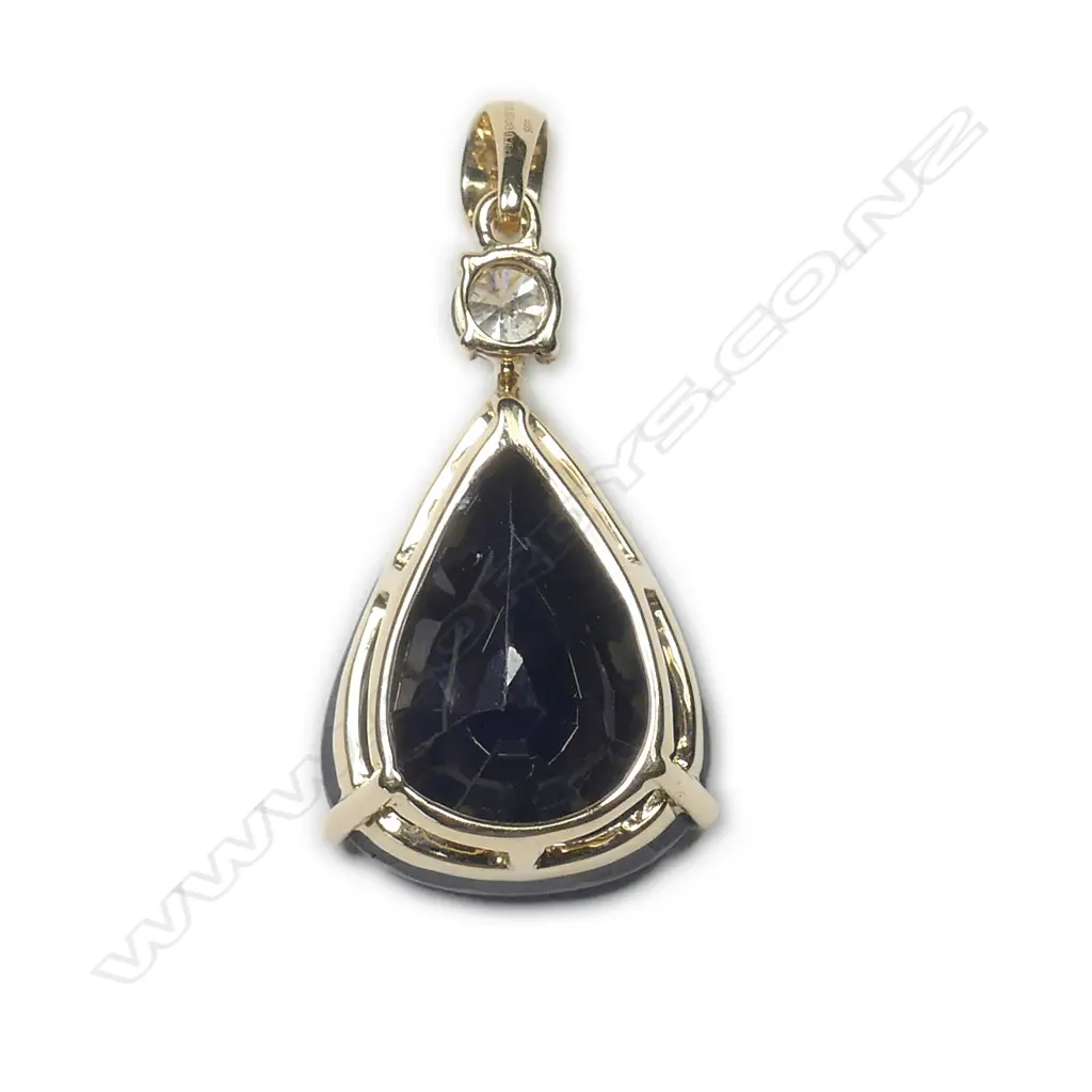 A 14ct gold sapphire and diamond pendant Image 1++