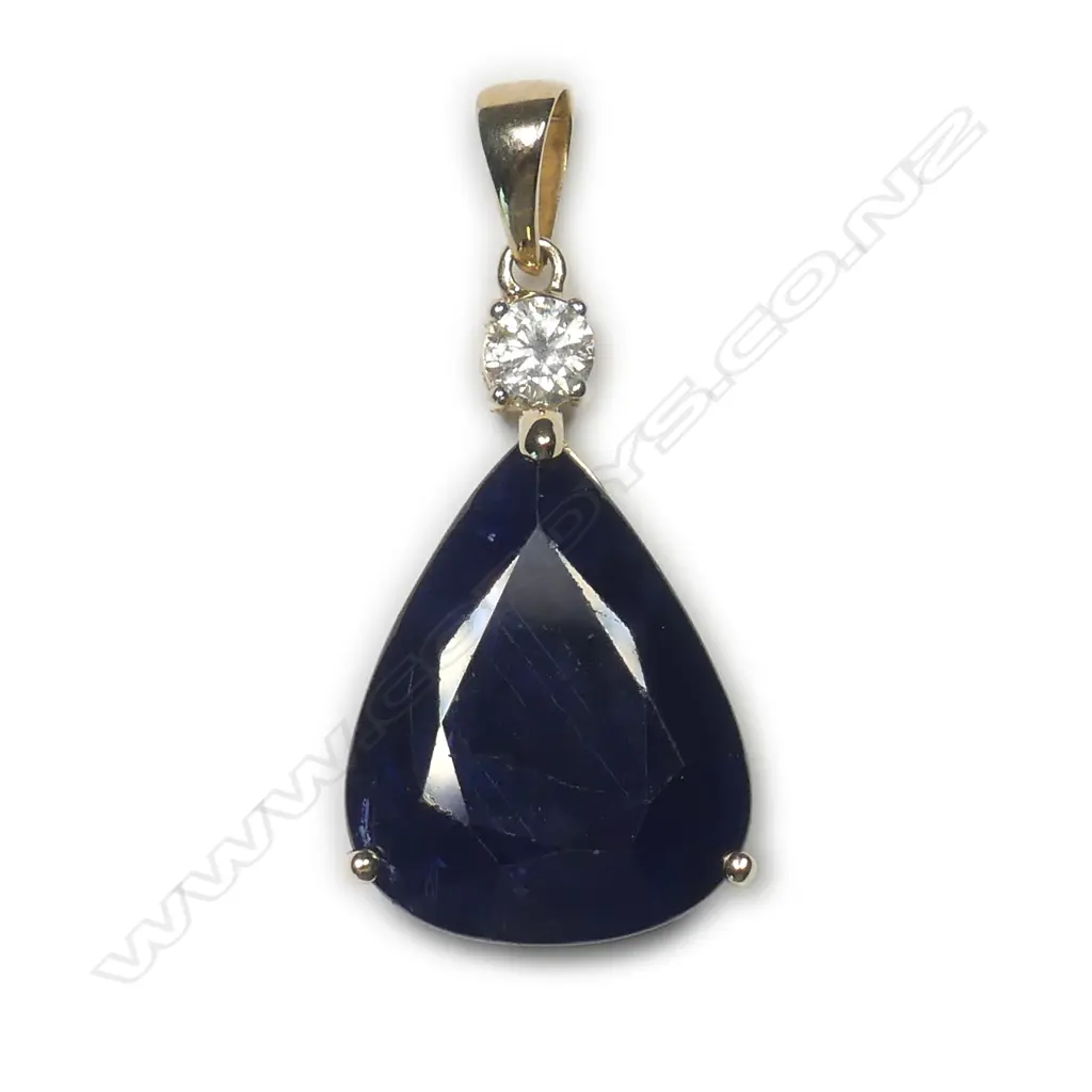 A 14ct gold sapphire and diamond pendant Image 1++