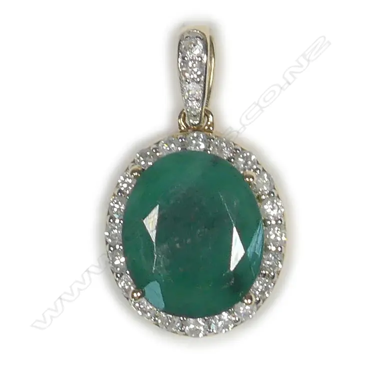 A 14ct gold emerald and diamond halo pendant Image 1++