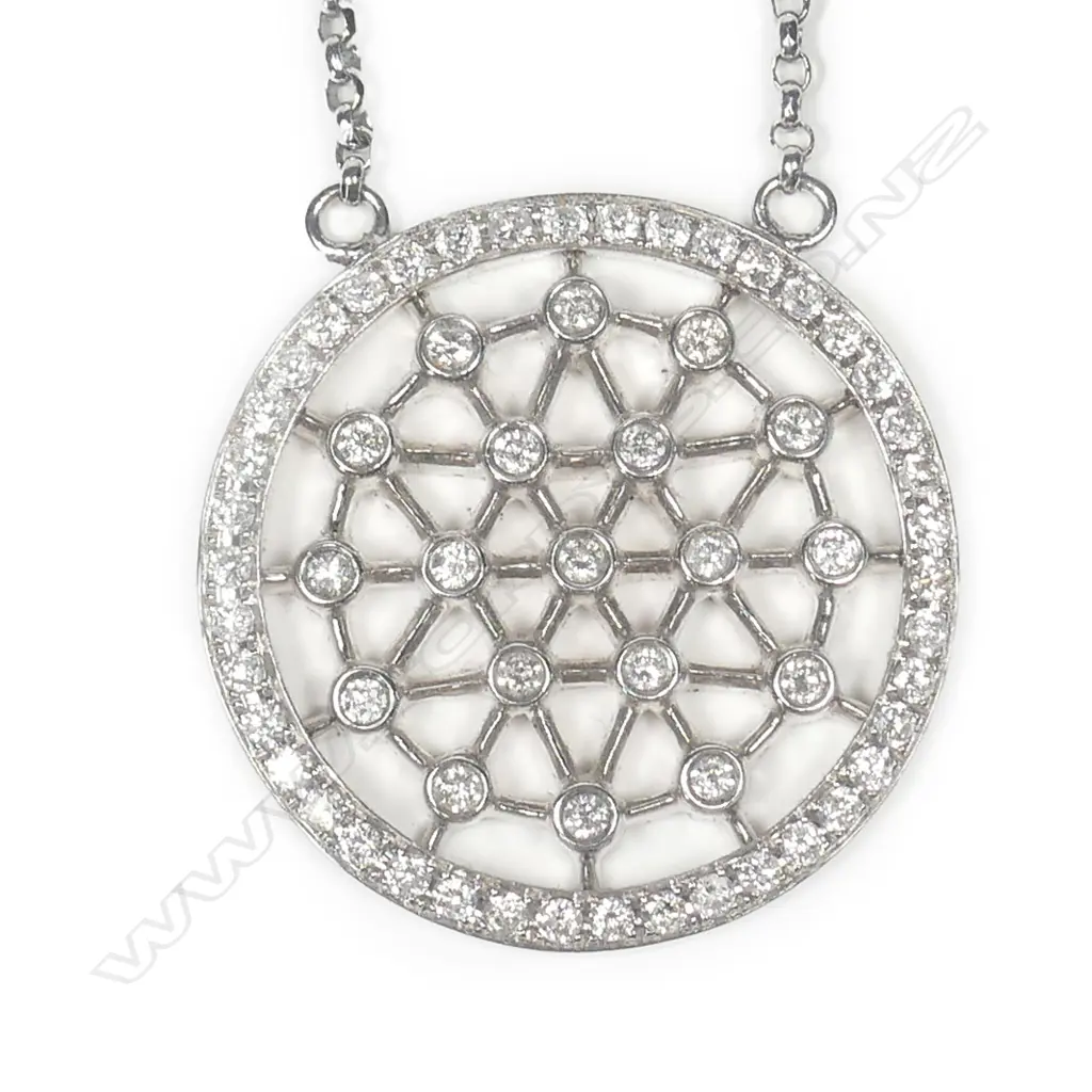 An 18ct white gold diamond pendant on chain Image 1++