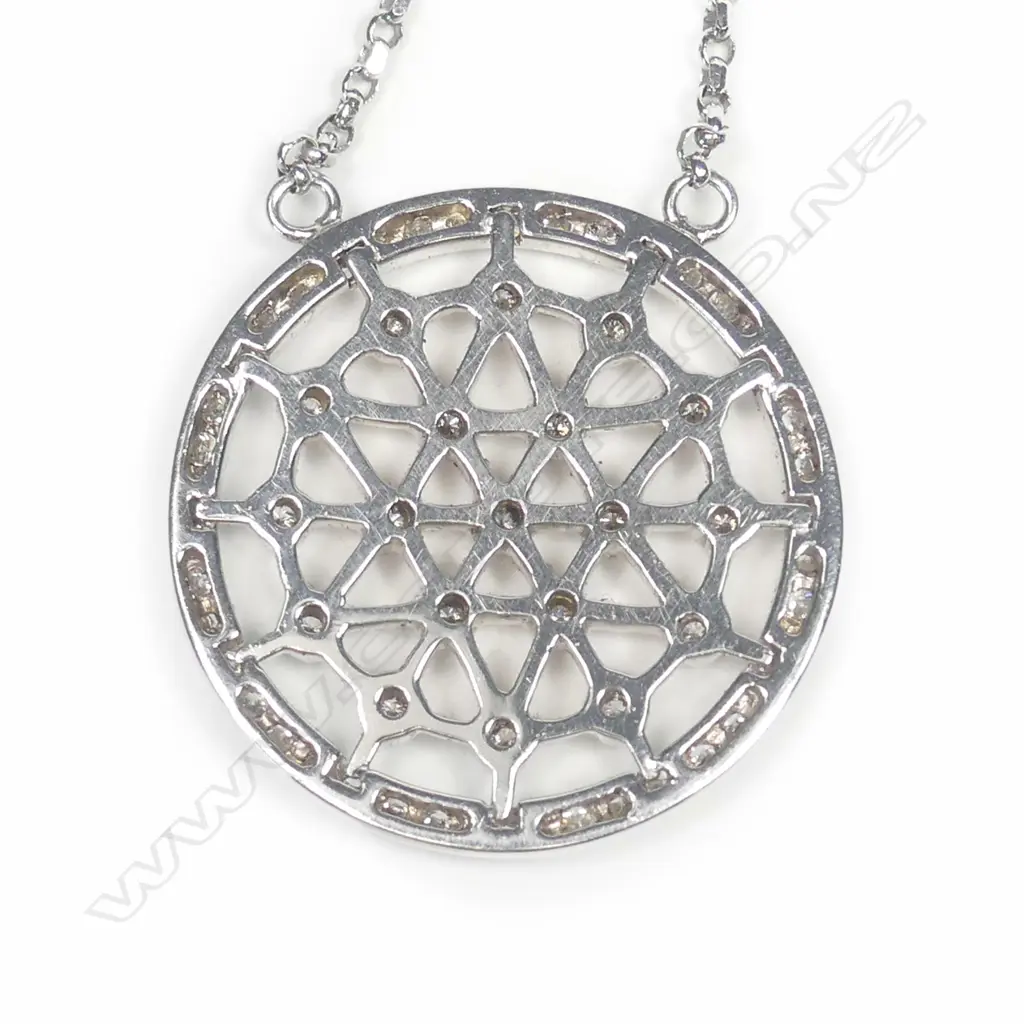 An 18ct white gold diamond pendant on chain Image 1++