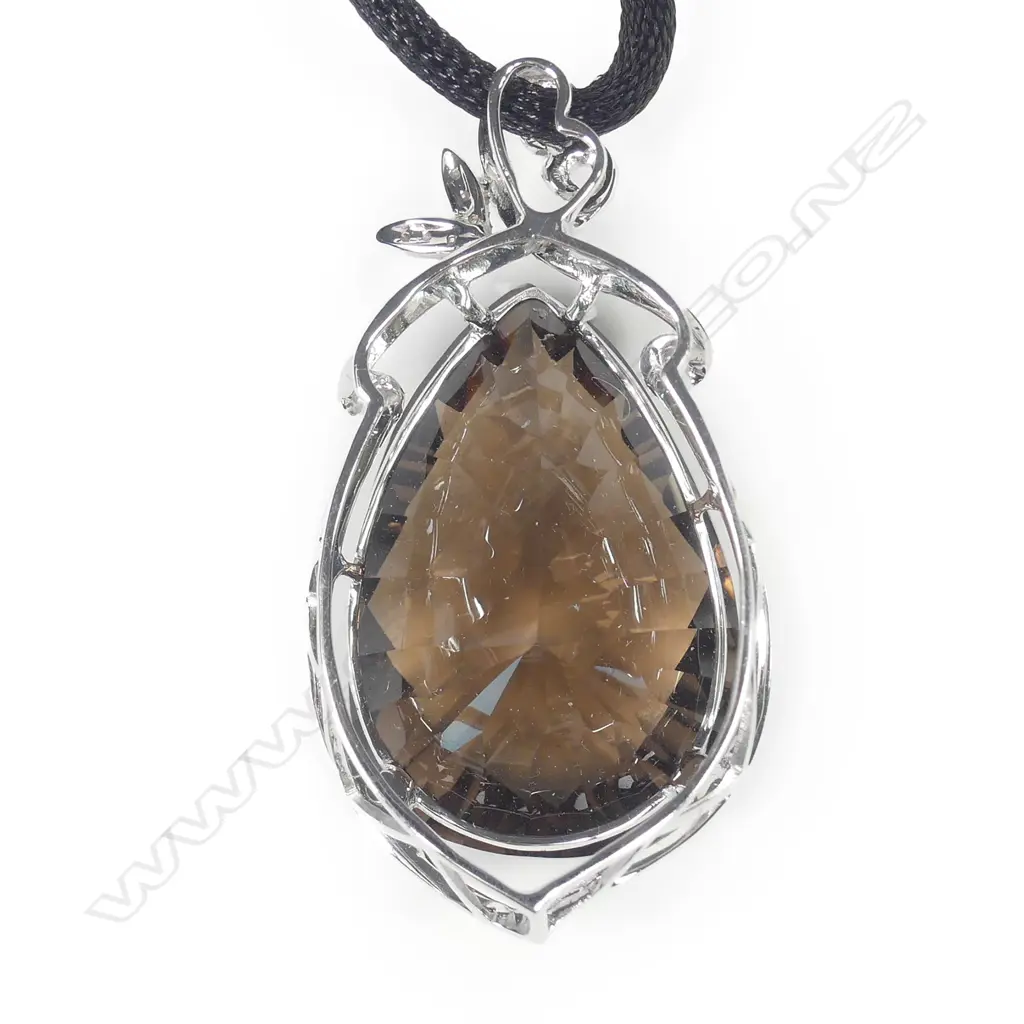 An 18ct white gold diamond and amethyst pendant Image 1++