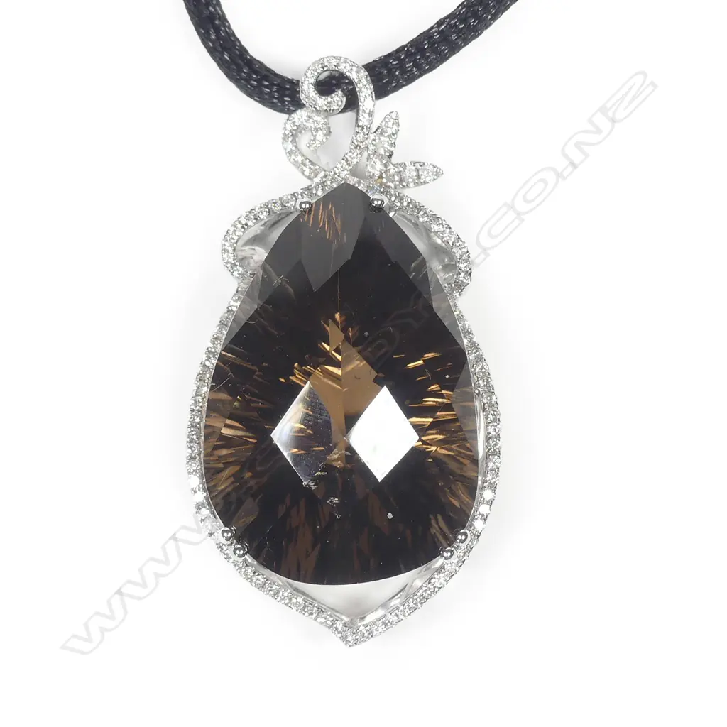 An 18ct white gold diamond and amethyst pendant Image 1++