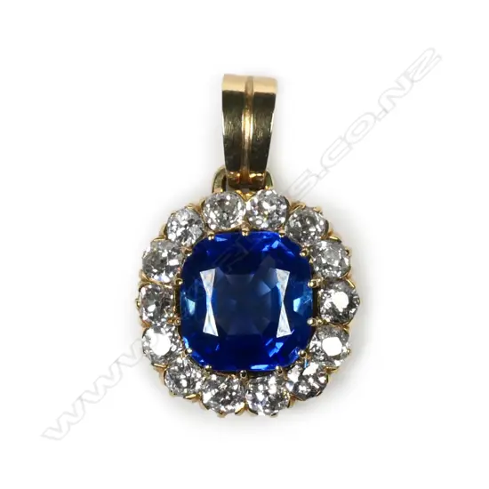 An 17ct gold sapphire and diamond pendant