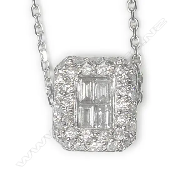 A 9ct white gold and diamond pendant on chain Image 1++