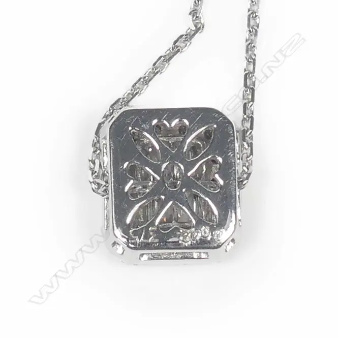 A 9ct white gold and diamond pendant on chain Image 1++