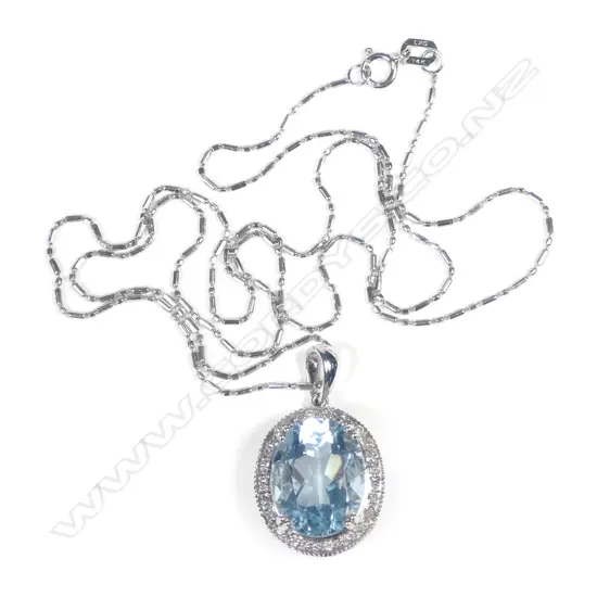 A 14ct white gold aquamarine and diamond pendant necklace