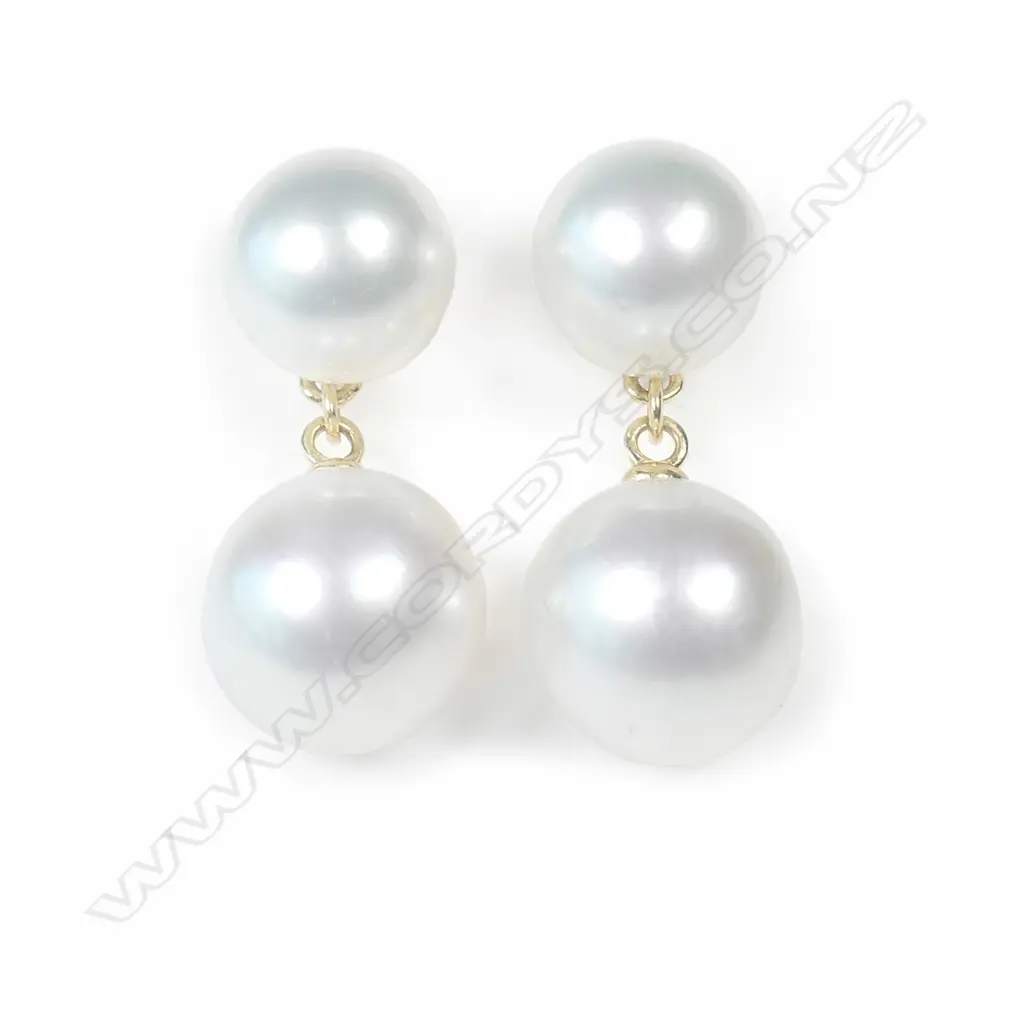 A pair of 18ct gold and double pearl drop earrings Image 1++