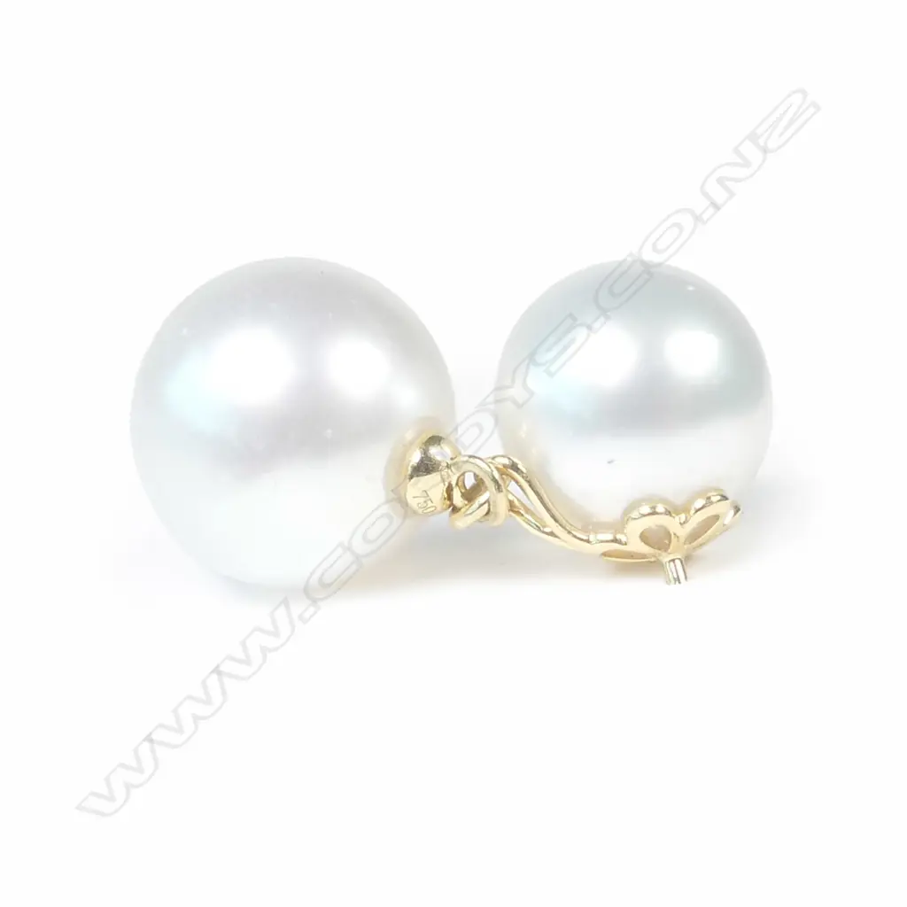 A pair of 18ct gold and double pearl drop earrings Image 1++
