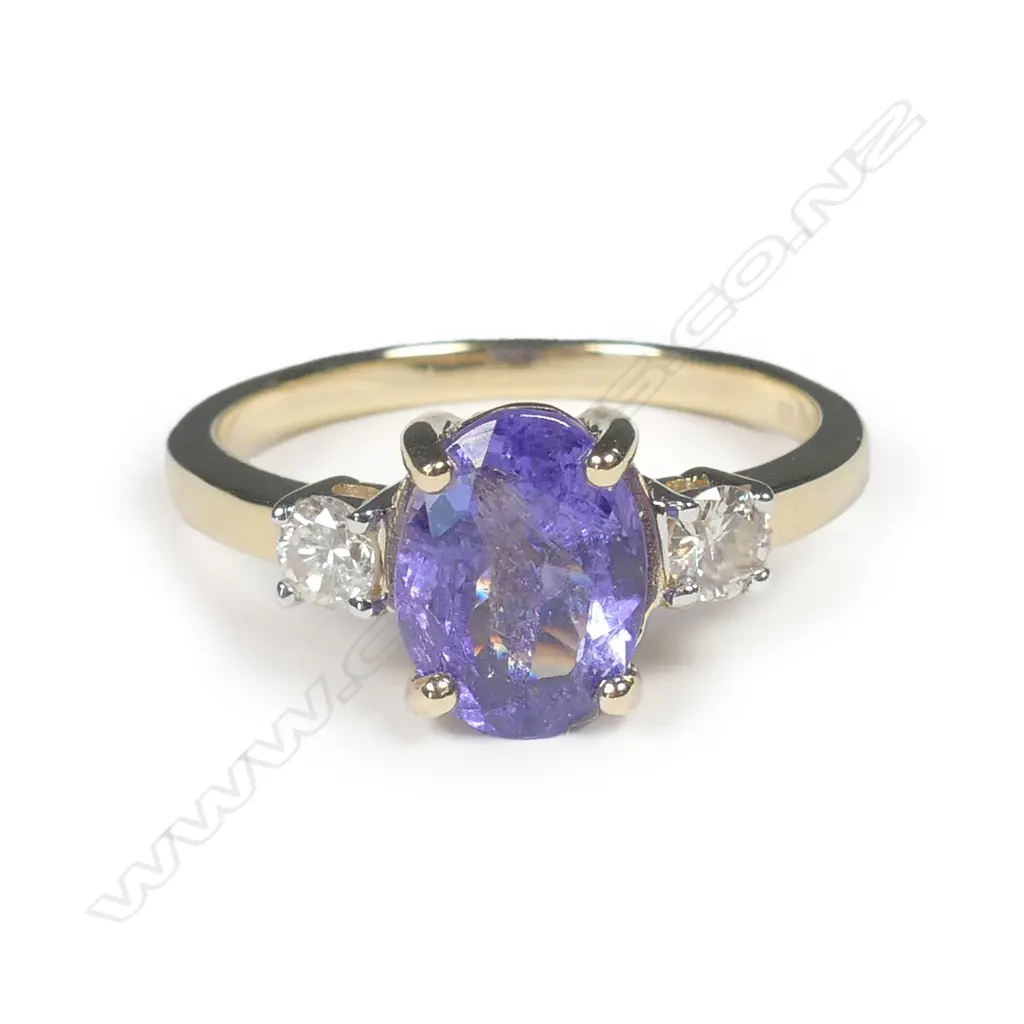 A 14ct yellow gold tanzanite and diamond ring Image 1++