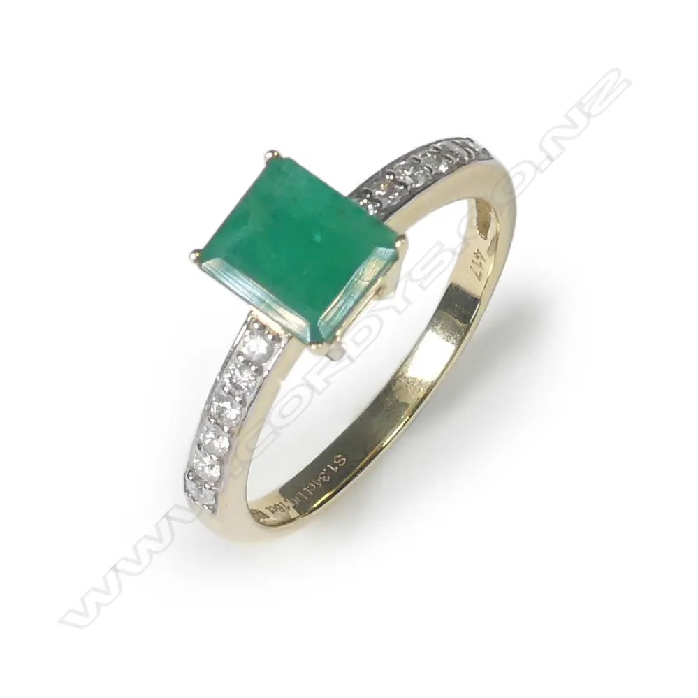 A 10ct gold emerald and diamond ring Image 1++