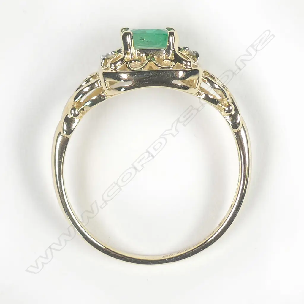 A 10ct gold emerald and diamond ring Image 1++