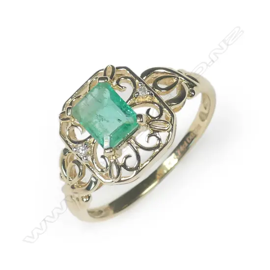 A 10ct yellow gold emerald and diamond filigree ring