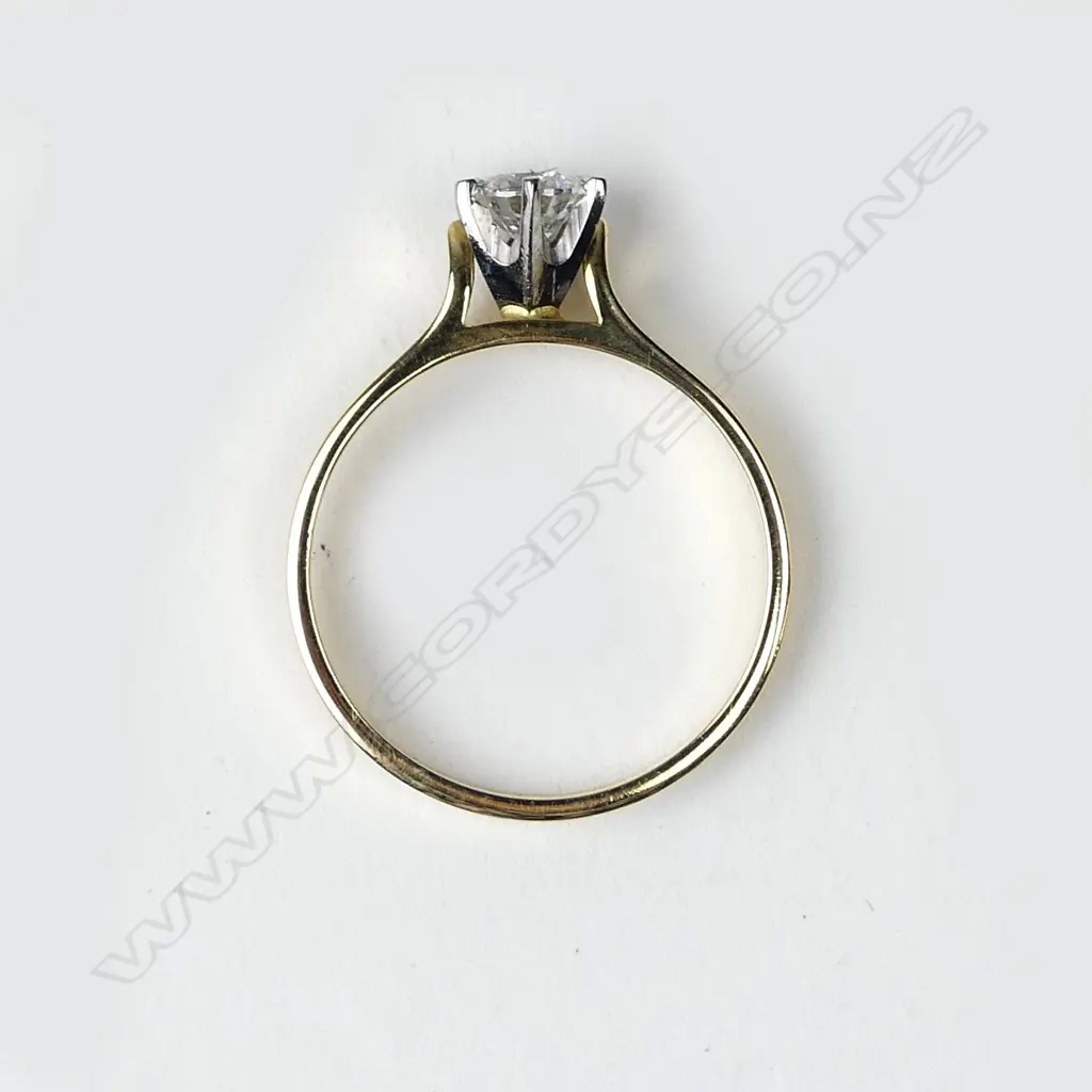 An 18ct gold solitaire diamond ring Image 1++