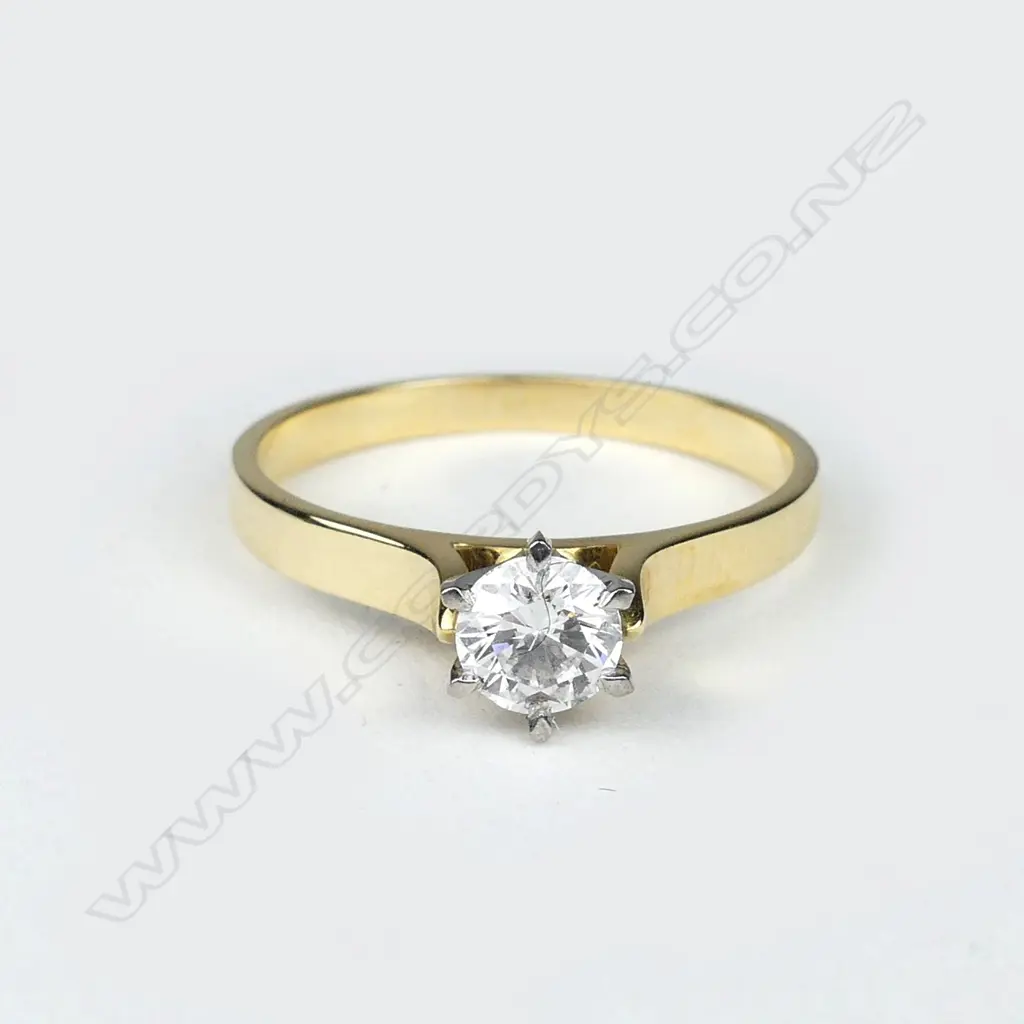 An 18ct gold solitaire diamond ring Image 1++