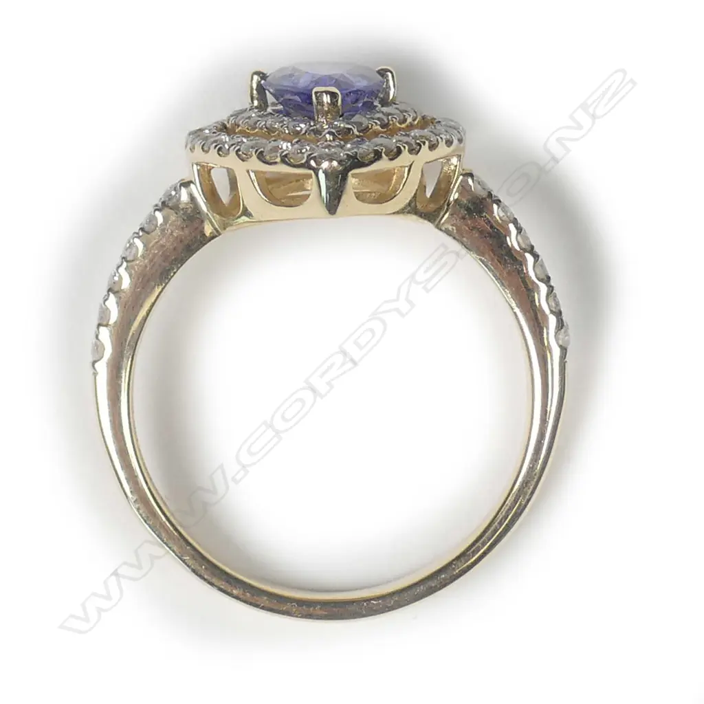 A 14ct rose gold sapphire and diamond double halo ring Image 1++