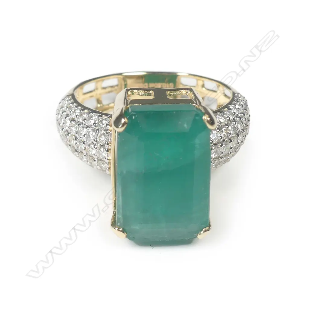 A 14ct yellow gold emerald and diamond dress ring Image 1++