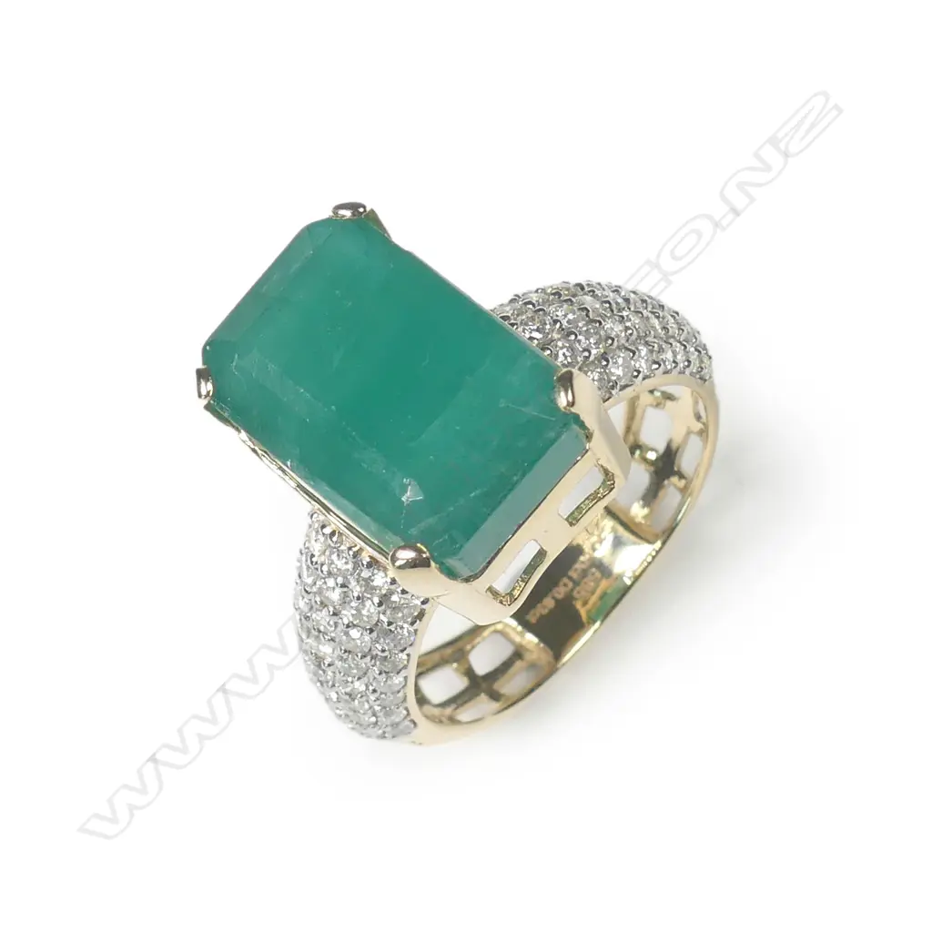 A 14ct yellow gold emerald and diamond dress ring Image 1++