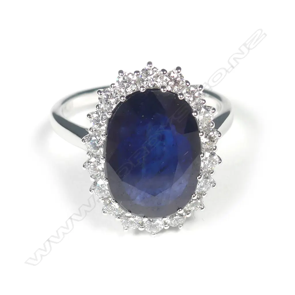 A 14ct white gold sapphire and diamond ring Image 1++