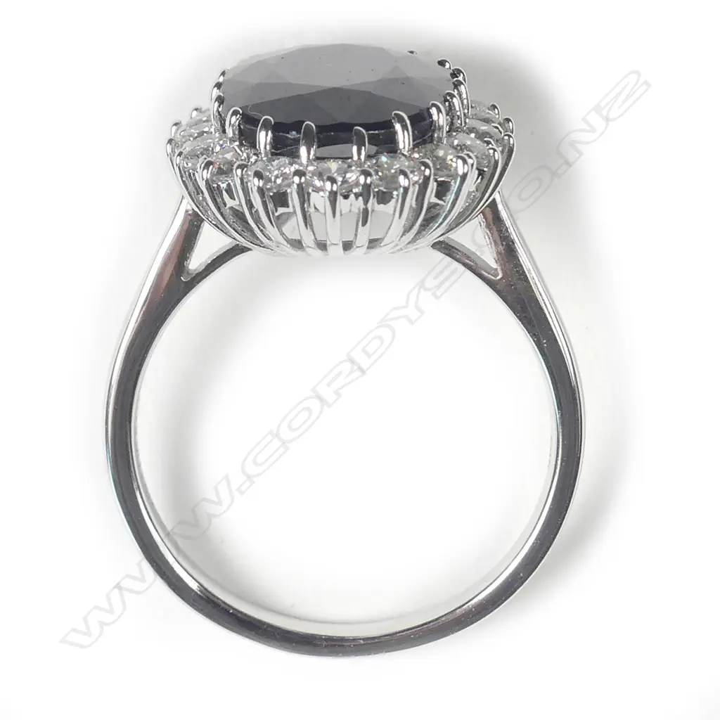 A 14ct white gold sapphire and diamond ring Image 1++