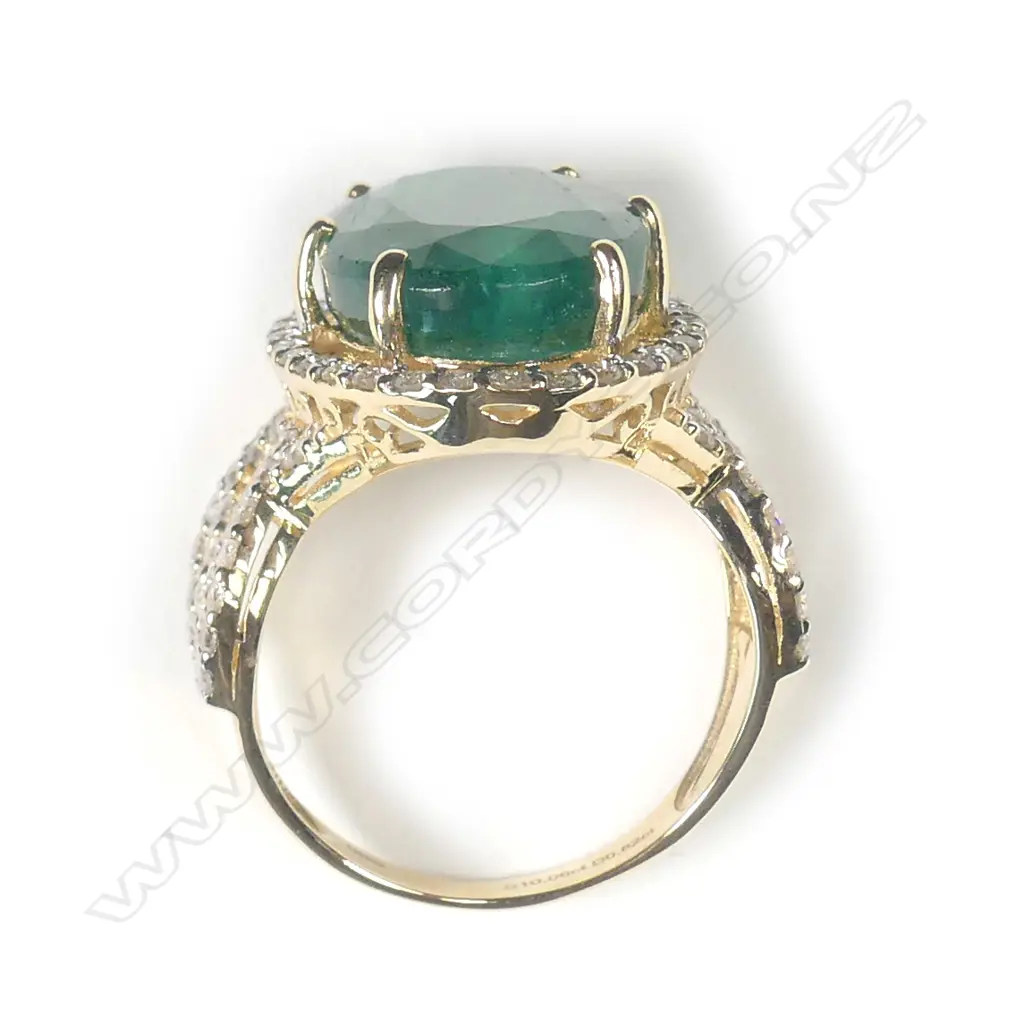 A 14ct gold emerald and diamond ring Image 1++