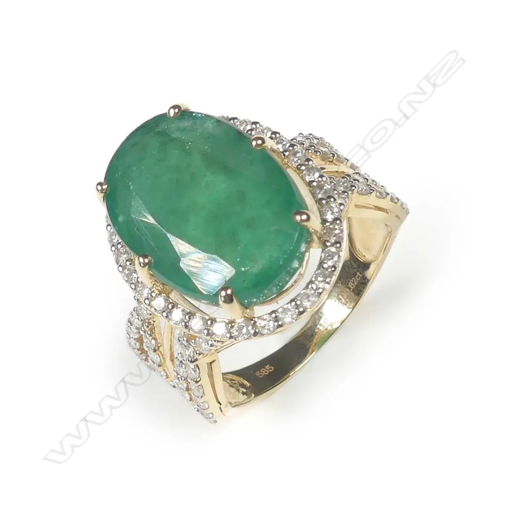 A 14ct gold emerald and diamond ring Image 1++