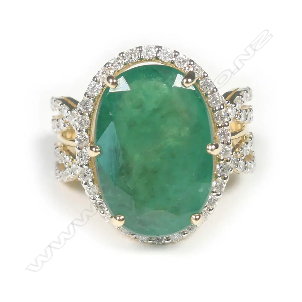 A 14ct gold emerald and diamond ring Image 1++