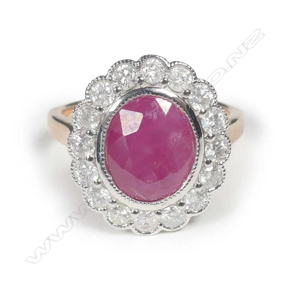 A 14ct rose gold ruby and diamond halo ring Image 1++