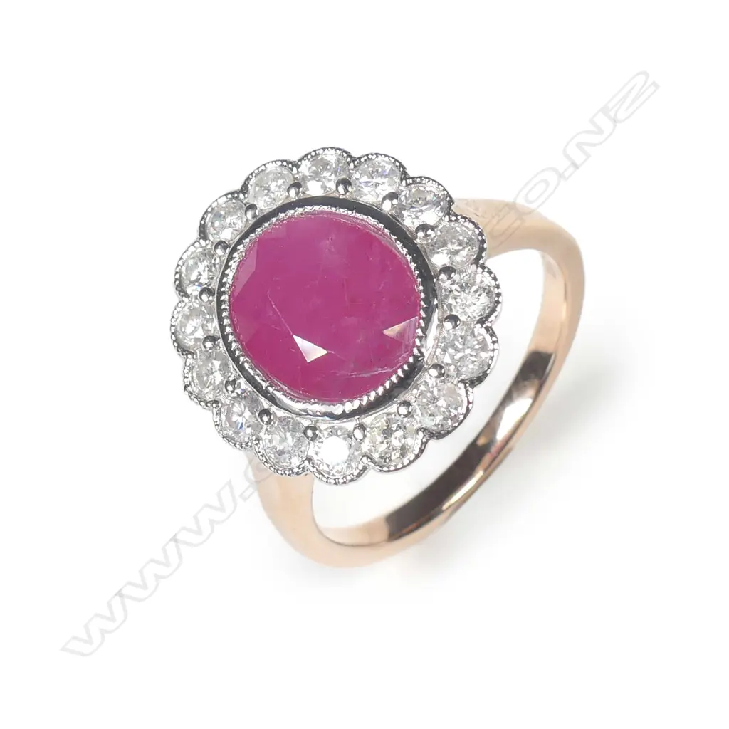 A 14ct rose gold ruby and diamond halo ring Image 1++