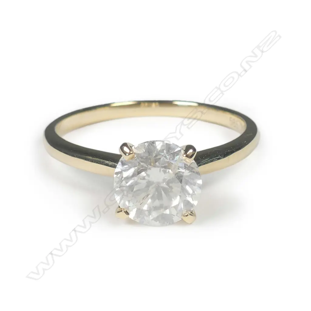 A 14ct yellow gold diamond solitaire ring Image 1++