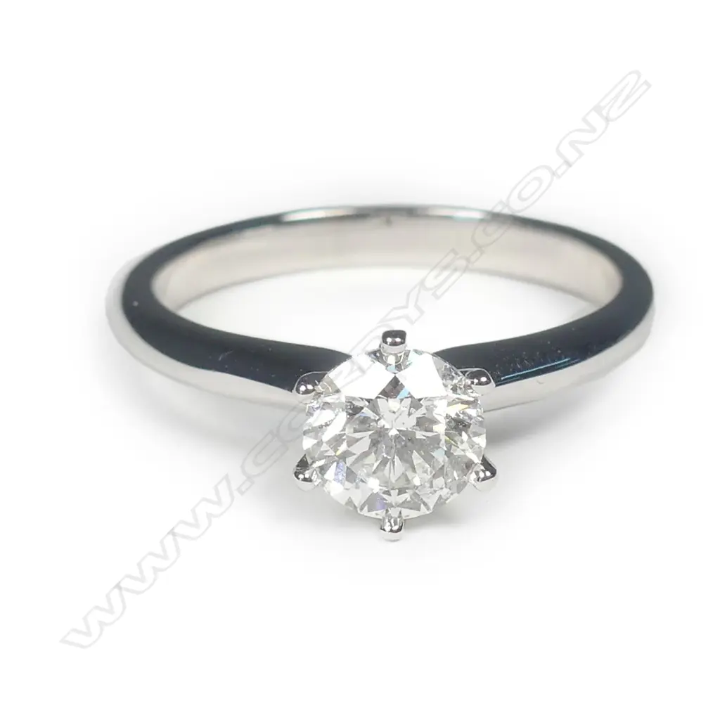 An 18ct white gold and diamond solitaire ring Image 1++